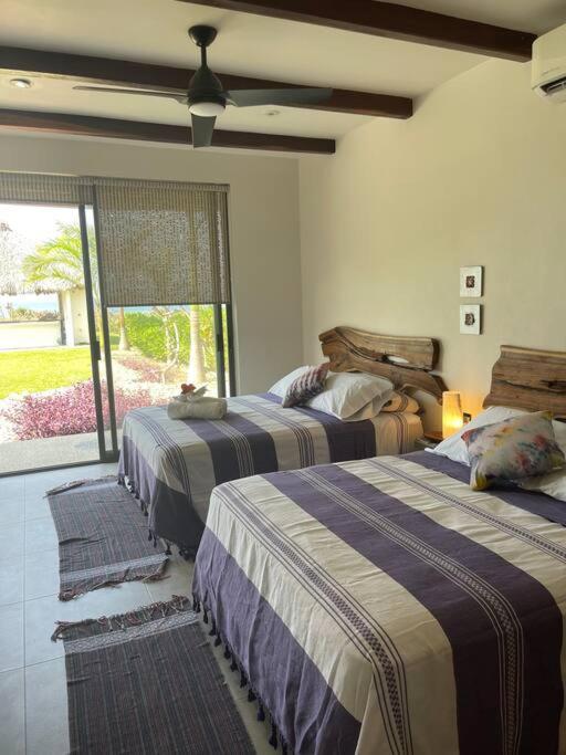 Villa De Las Rocas ปูแอร์โตเอสกอนดิโด ภายนอก รูปภาพ