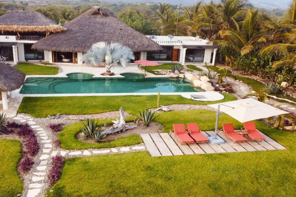 Villa De Las Rocas ปูแอร์โตเอสกอนดิโด ภายนอก รูปภาพ