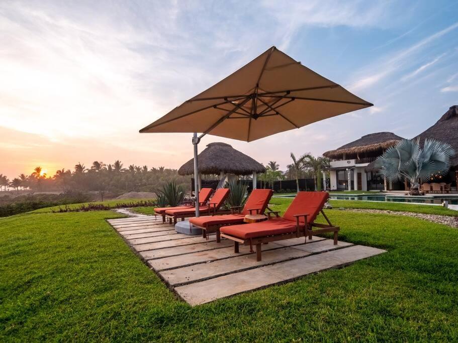 Villa De Las Rocas ปูแอร์โตเอสกอนดิโด ภายนอก รูปภาพ