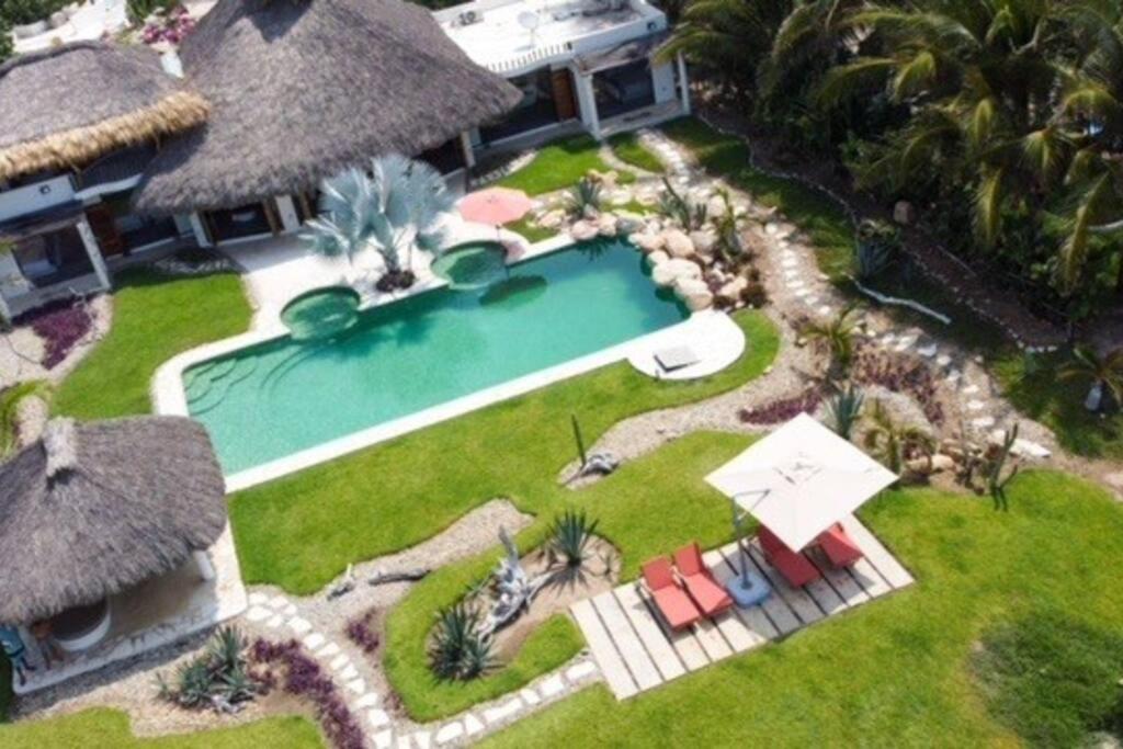 Villa De Las Rocas ปูแอร์โตเอสกอนดิโด ภายนอก รูปภาพ